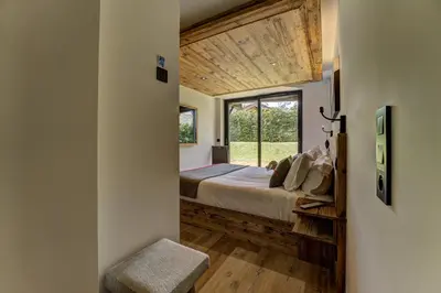 a bedroom with a bed and a window at Chalet Red Fox in Chamonix-Mont-Blanc