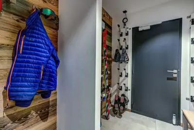a door to a room with a bunch of shoes at Chalet Red Fox in Chamonix-Mont-Blanc