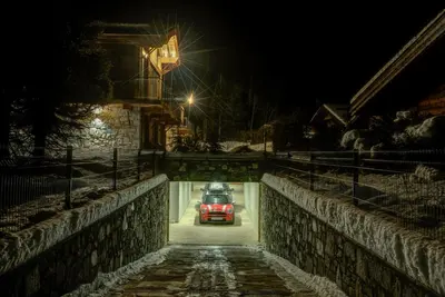a car driving through a tunnel at night at Chalet Red Fox in Chamonix-Mont-Blanc