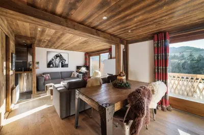 a living room with a couch and a table at Flat Simba - Megève - Mont d'Arbois in Megève