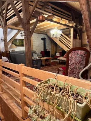 a room with a bench with a table and chairs at Ferme savoyarde rénovée 2 chambres in Les Carroz d'Araches