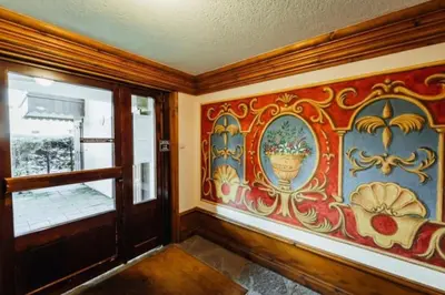 a room with a painting on the wall and a window at Cocon familial proche télécabine in Saint-Gervais-les-Bains