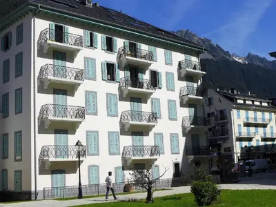 a view of a building with mountains in the background at Apartment Le Pavillon-3 by Interhome in Chamonix-Mont-Blanc