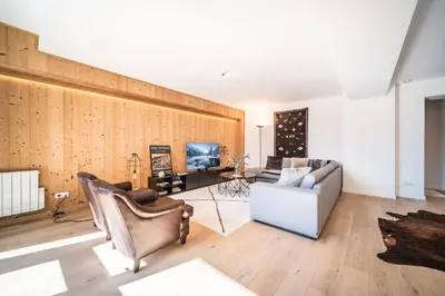 a living room with two chairs and a couch at Apartment Le Gui Chamonix - BY EMERALD STAY in Chamonix-Mont-Blanc