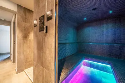 a swimming pool in a room with a shower at Apartment Le Gui Chamonix - BY EMERALD STAY in Chamonix-Mont-Blanc