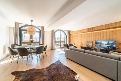 a living room with a couch and a table at Apartment Le Gui Chamonix - BY EMERALD STAY in Chamonix-Mont-Blanc