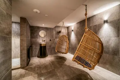 a bathroom with a swing and tiled walls at Apartment Le Gui Chamonix - BY EMERALD STAY in Chamonix-Mont-Blanc