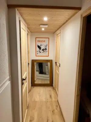 a hallway leading to a room with a hallwayngthngthngthngthngthngthngth at Megeve centre in Megève
