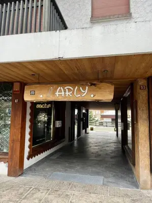 an entrance to a store with a sign on it at Megeve centre in Megève