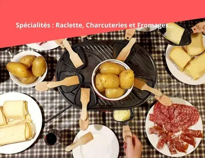a table with plates of food and a pot of potatoes and meat at Le Mazots, Balcon, Parking, Proche Pistes in Arâches-la-Frasse