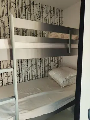 a bunk bed in a room with a bunk bed gmaxwell gmaxwell gmaxwell gmaxwell at Le Mazots, Balcon, Parking, Proche Pistes in Arâches-la-Frasse