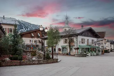 a street in a town with a building at Studio l'Orée - City centre - Megève in Megève