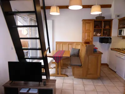 a kitchen with a table and a dining room at Résidence Palmes D'or - Palmes d'Or B33 MAE-5784 in Les Contamines-Montjoie