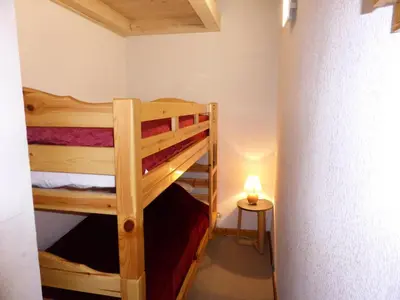 two bunk beds in a small room with a lamp at Résidence Palmes D'or - Palmes d'Or B33 MAE-5784 in Les Contamines-Montjoie