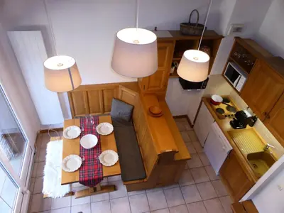 an overhead view of a small kitchen with a table at Résidence Palmes D'or - Palmes d'Or B33 MAE-5784 in Les Contamines-Montjoie