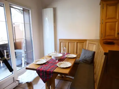 a table with plates and bowls on it in a kitchen at Résidence Palmes D'or - Palmes d'Or B33 MAE-5784 in Les Contamines-Montjoie