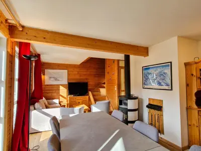 a room with a bed and a living room at Chalet confortable à Flaine avec poêle et WIFI - FR-1-425-198 in Arâches-la-Frasse