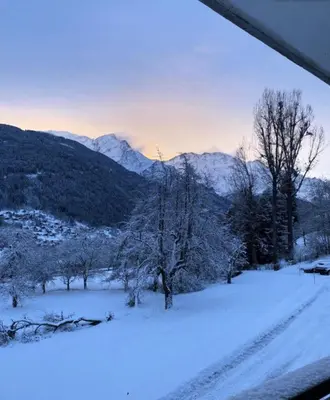 a snow covered field with trees and mountains at Résidence Soleil D'arbois - Anemones - Soleil d'Arbois Anémones 507 MAE-7774 in Saint-Gervais-les-Bains