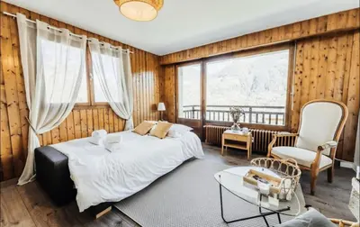 a bedroom with a bed and a large window at Résidence Soleil D'arbois - Anemones - Soleil d'Arbois Anémones 507 MAE-7774 in Saint-Gervais-les-Bains