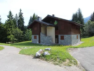 a small building with rocks in front of it at Appartement 3 pièces cabine, 6 pers, face au spa et au ski bus, proche pistes et commodités - FR-1-572-45 in Arâches-la-Frasse