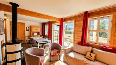 a living room with a fireplace and a dining room at Résidence Hameau - Chalet confortable · Poêle à bois · Terrasse · Garage · WIFI gratuit MAE-8714 in Magland