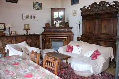 a living room filled with furniture and a fireplace at La Maison des Praz in Saint-Gervais-les-Bains
