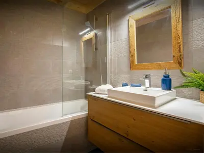 a bathroom with a sink and a shower at Chalet Alpayak - OVO Network in Combloux