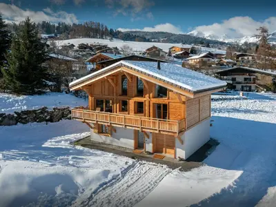 a wooden house in the snow with snow at Chalet Alpayak - OVO Network in Combloux