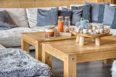 a living room with a coffee table and a couch at Chalet****Luxe Sauna & SPA Le Champenois in Samoëns