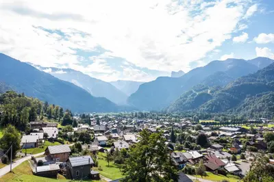 a town in a valley with mountains in the background at Chalet****Luxe Sauna & SPA Le Champenois in Samoëns