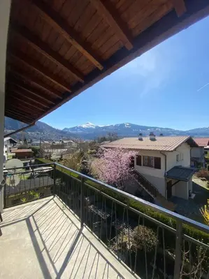 a balcony with a view of a house at Logement entier dans maison - Passy - 6 personnes in Passy