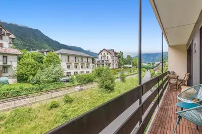 a balcony with a view of a city at Appartement Cosy, Chamonix Centre in Chamonix-Mont-Blanc