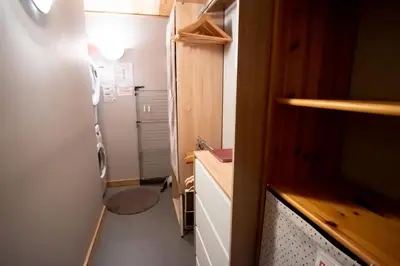 a small kitchen with a refrigerator and a sink at Refuge des Alpages - Duplex - Vue Aiguillette des Houches in Les Houches