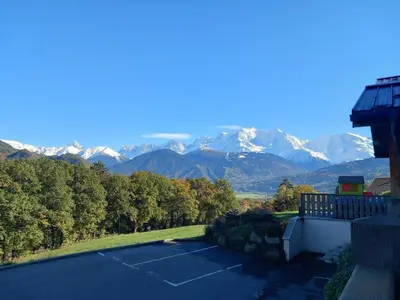 a view of a parking lot with mountains in the background at Les Hauts de Sallanches in Sallanches