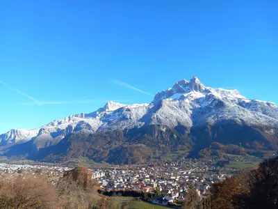 a view of a town in front of a mountain at Les Hauts de Sallanches in Sallanches