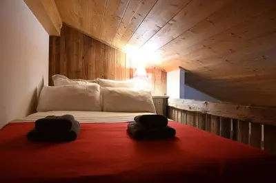 a bedroom with a bed with two towels on it at Three bedroom Apartment, Samoens, Grand Massif in Samoëns