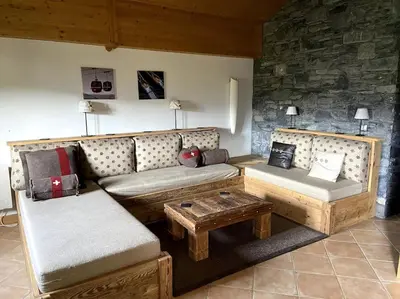 a kitchen with a wooden table and chairs in a kitchen at Three bedroom Apartment, Samoens, Grand Massif in Samoëns