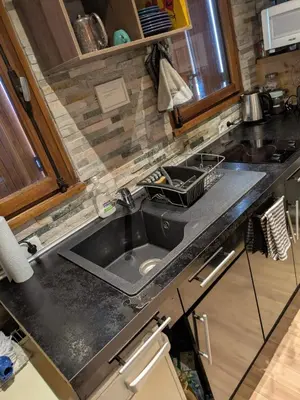 a kitchen with a sink and a counter top at SebRem in Megève