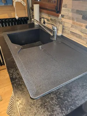 a kitchen counter with a sink in a kitchen at SebRem in Megève