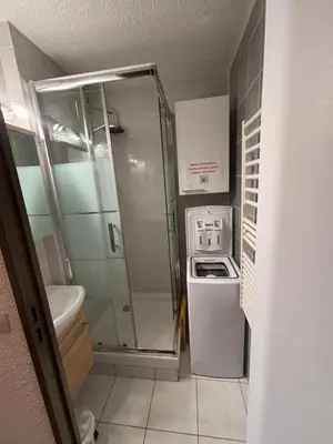 a small bathroom with a shower and a sink at Samoens 1600 les cimes in Samoëns