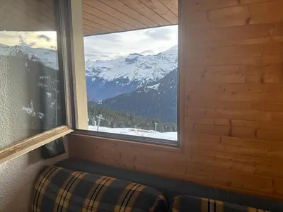 a window in a room with a view of a mountain at Samoens 1600 les cimes in Samoëns
