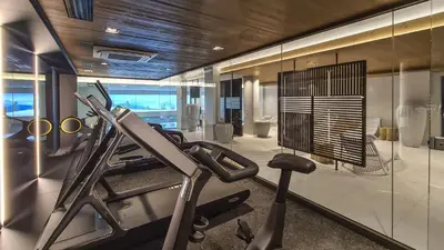 a fitness room with a gym with a treadmill at Stallion d15 MEGEVE in Megève
