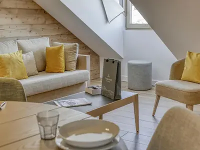 a bedroom with wooden walls and a bed with two pillows at Studio cosy avec mezzanine, proche centre et télécabine - 2 pers. - FR-1-663-20 in Saint-Gervais-les-Bains