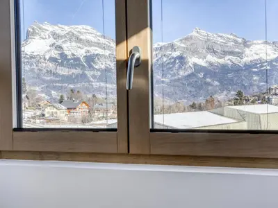 a living room with chairs and a tv and a table at Studio cosy avec mezzanine, proche centre et télécabine - 2 pers. - FR-1-663-20 in Saint-Gervais-les-Bains