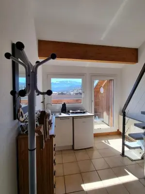 a kitchen with a large window in a house at Vue magique in Sallanches