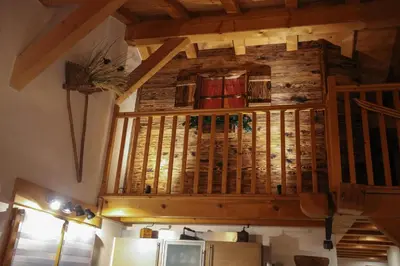 a wooden ceiling in a room with a refrigerator at SUPERBE DEMI CHALET LUXUEUX 120M² 8 Personnes à SALLANCHES. in Sallanches