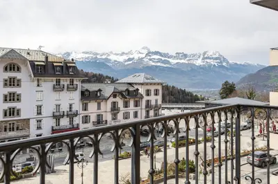a view of the mountains from the balcony of a building at Conseil B - Chic 2BR City Center Apartment - Free Parking & Mountain View - By Cozee Rentals in Saint-Gervais-les-Bains