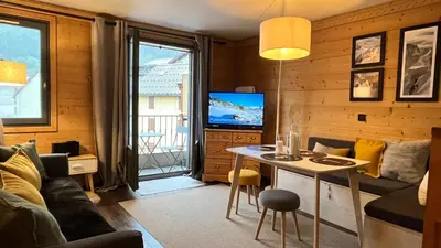 a kitchen with a sink and a stove at Le 41 du Lyret - Appartement type studio pour deux avec vue sur les Aiguilles dans Chamonix Centre in Chamonix-Mont-Blanc
