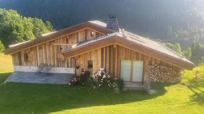 a log cabin with a window and a tower on top at chalet du Champel jacuzzi in Saint-Gervais-les-Bains