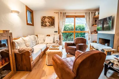a living room with a couch and chairs at Chalet Vorgeats 2 - 6 pers - Au pied de la Flégère - Golf - UTMB in Chamonix-Mont-Blanc
